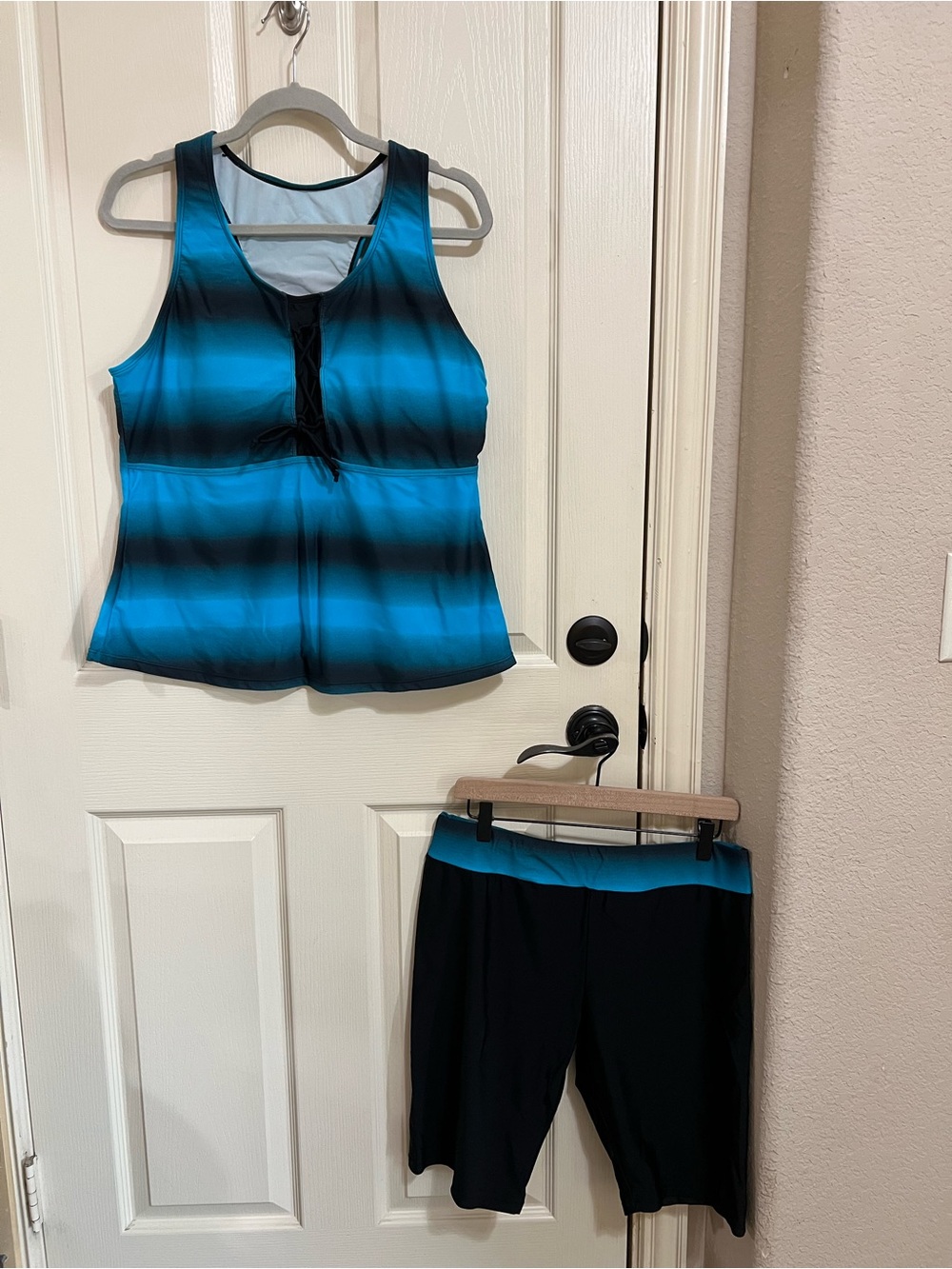 Sleeveless Blue Stripe Tankini Top and Black Swim Shorts